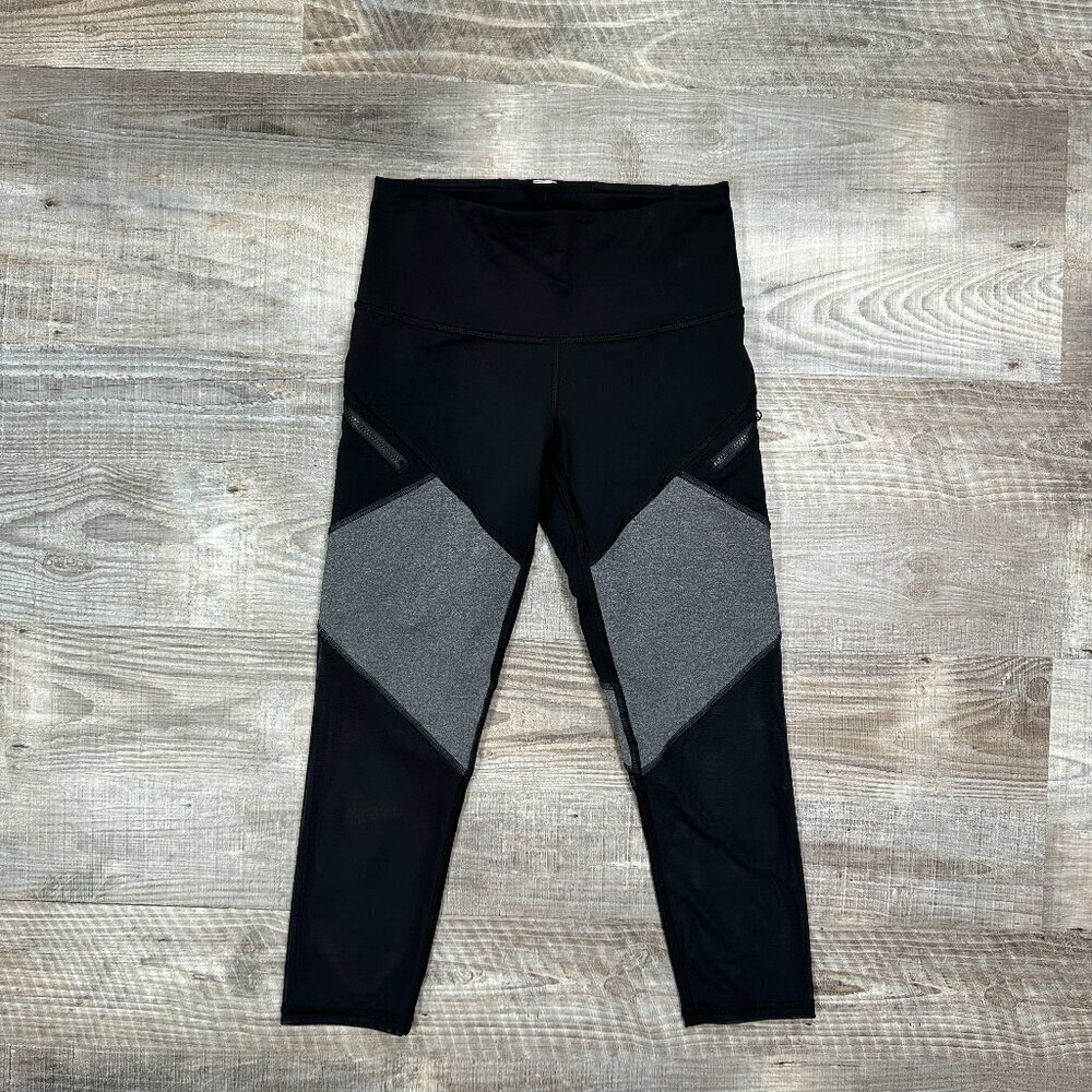 IVIVVA by Lululemon size 12 Crop Leggings Zip Pockets Mesh lower legs Black/Gray